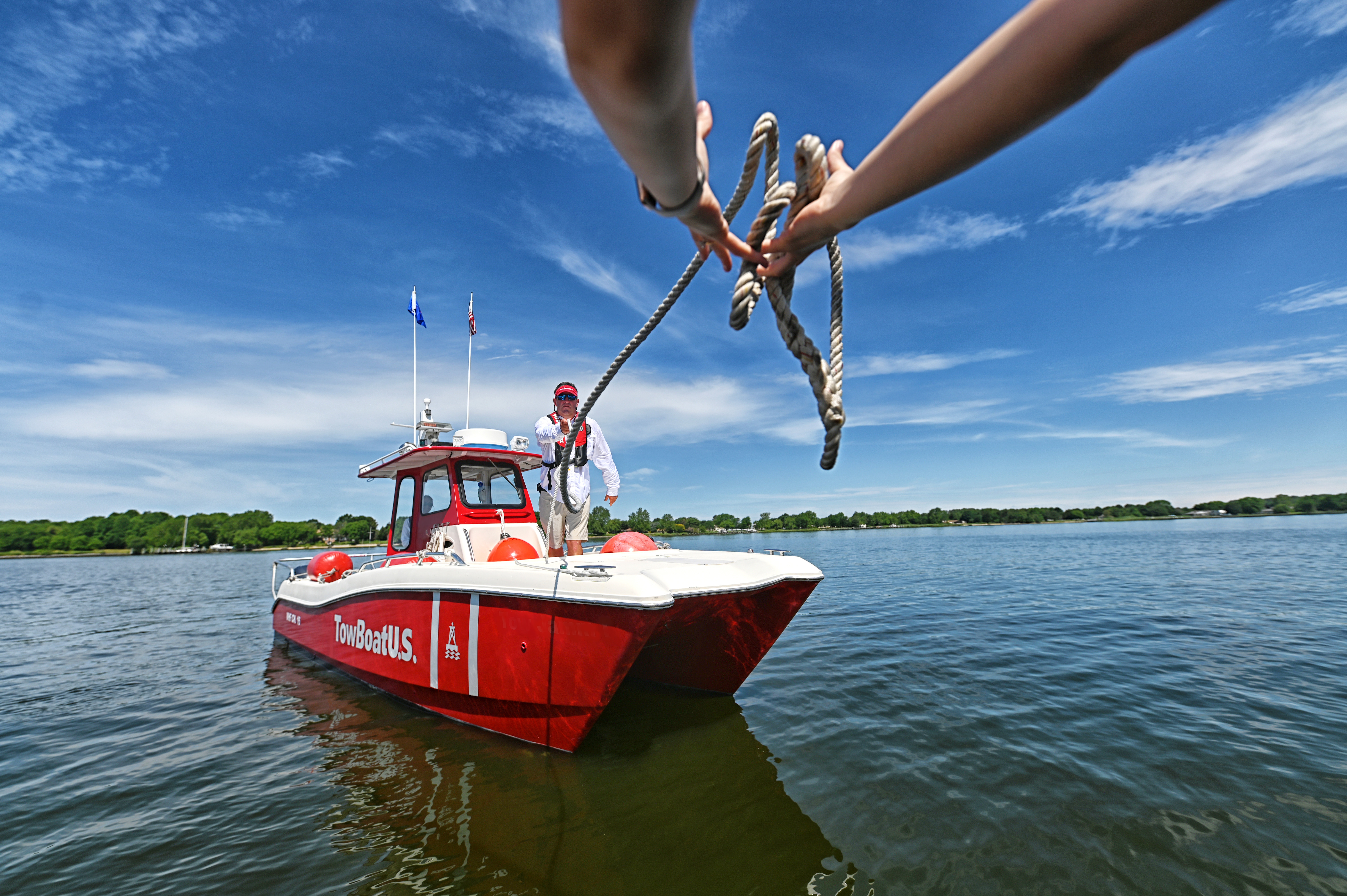 BoatUS membership offers 24/7 professional on-water towing and assistance with the red boats of TowBoatUS — the largest fleet of towboats in the country. (Credit: BoatUS).